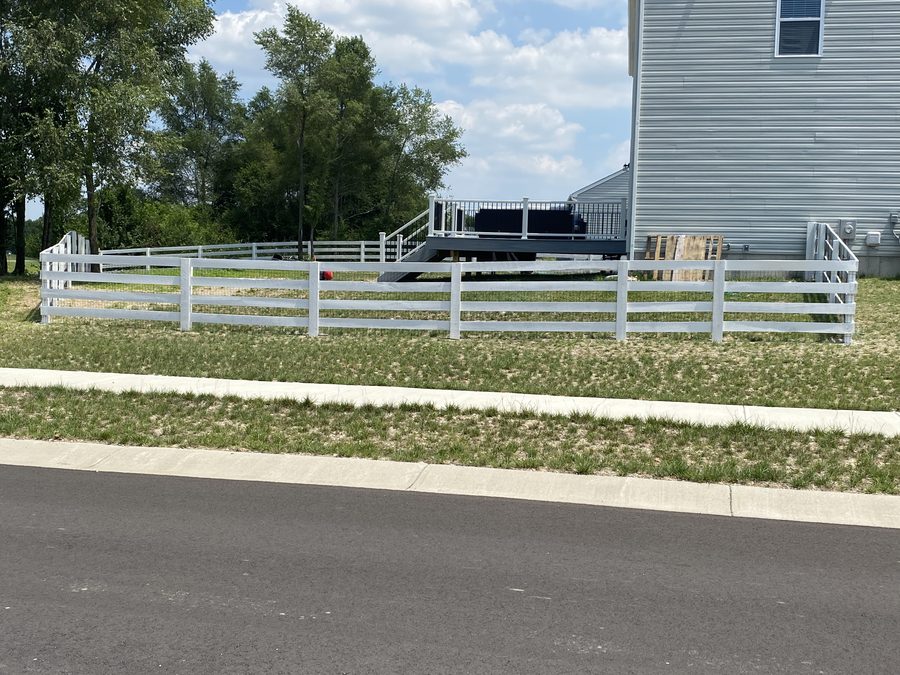 White 4-rail fence installed by Broadway Fence LLC