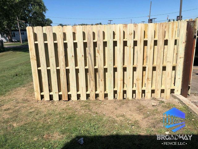Natural wood shadowbox privacy fence installed by Broadway Fence LLC