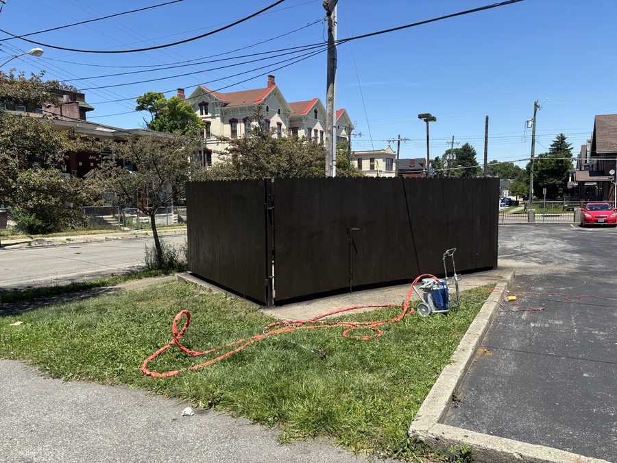 Dark stained wood privacy fence commercial dumpster enclosure by Broadway Fence LLC