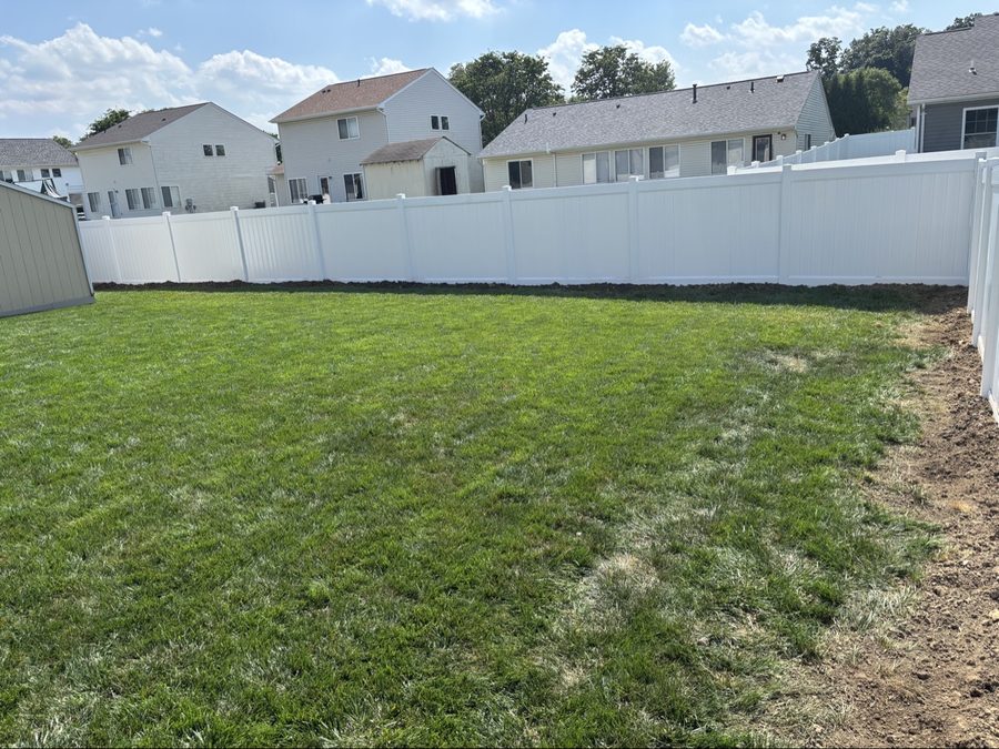 White vinyl privacy fence installed in a Dayton backyard
