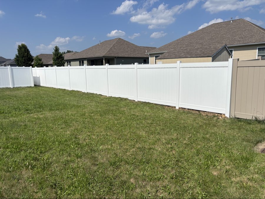 Long run of white vinyl privacy fencing in Dayton Ohio backyard